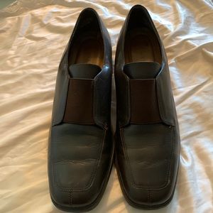 Dark brown slip on loafers.